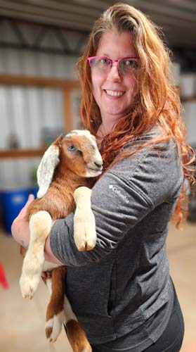 Faith with one of her goat babies