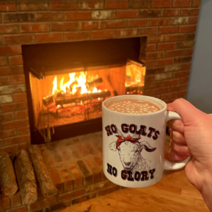 No goats no glory cup of hot chocolate mug of hot chocolate by the fire place